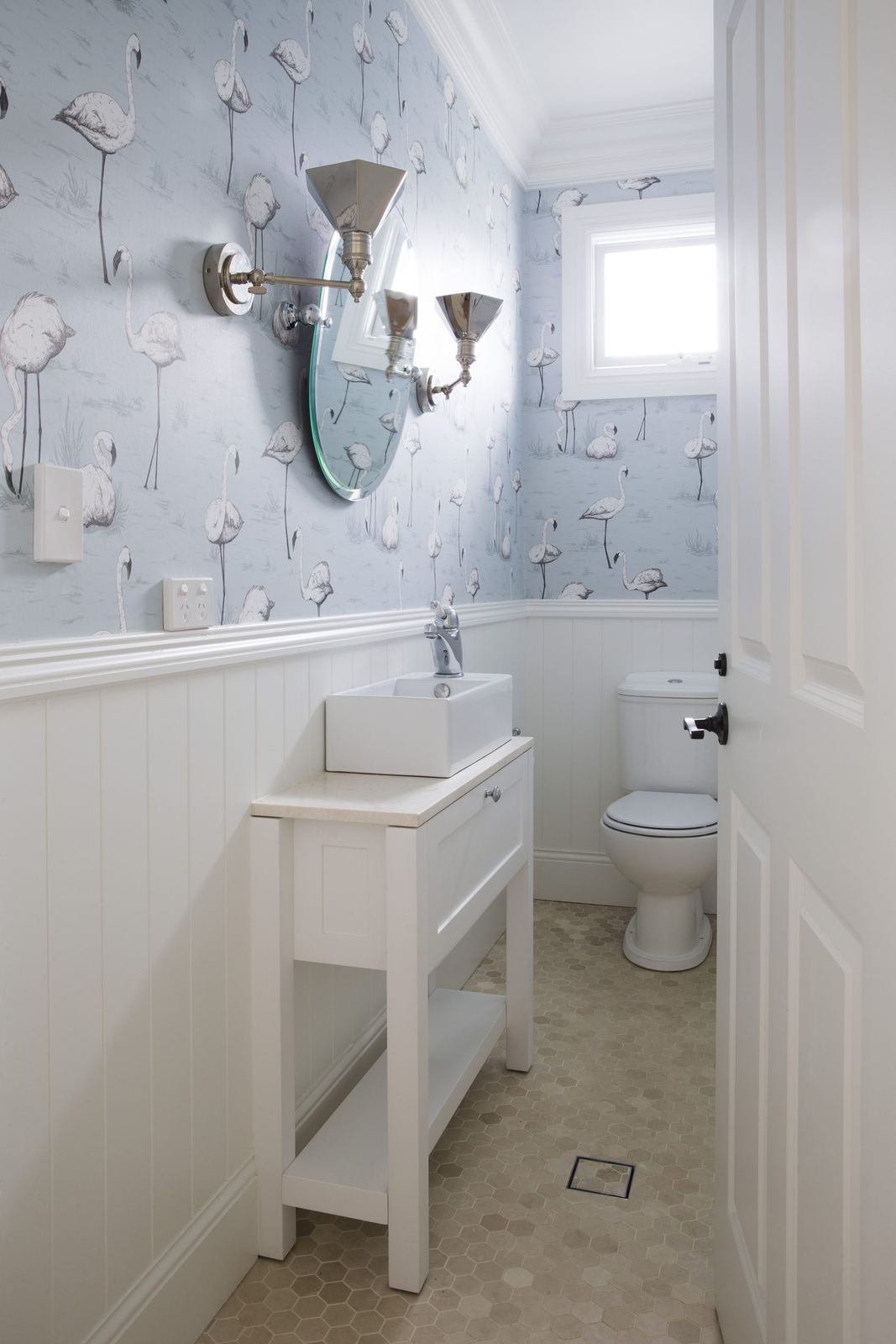 Balgowlah Heights — powder room with patterned wallpaper, white vanity and wall sconces, built by HP Constructions with All Australian Architecture