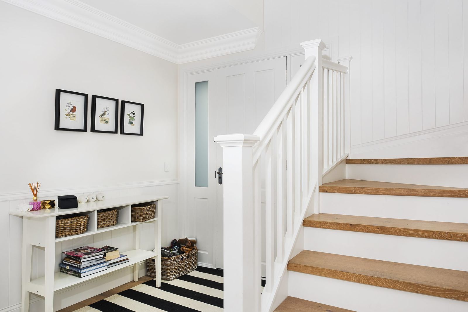 Balgowlah Heights — white timber staircase and entry hall with console table and striped runner, built by HP Constructions with All Australian Architecture