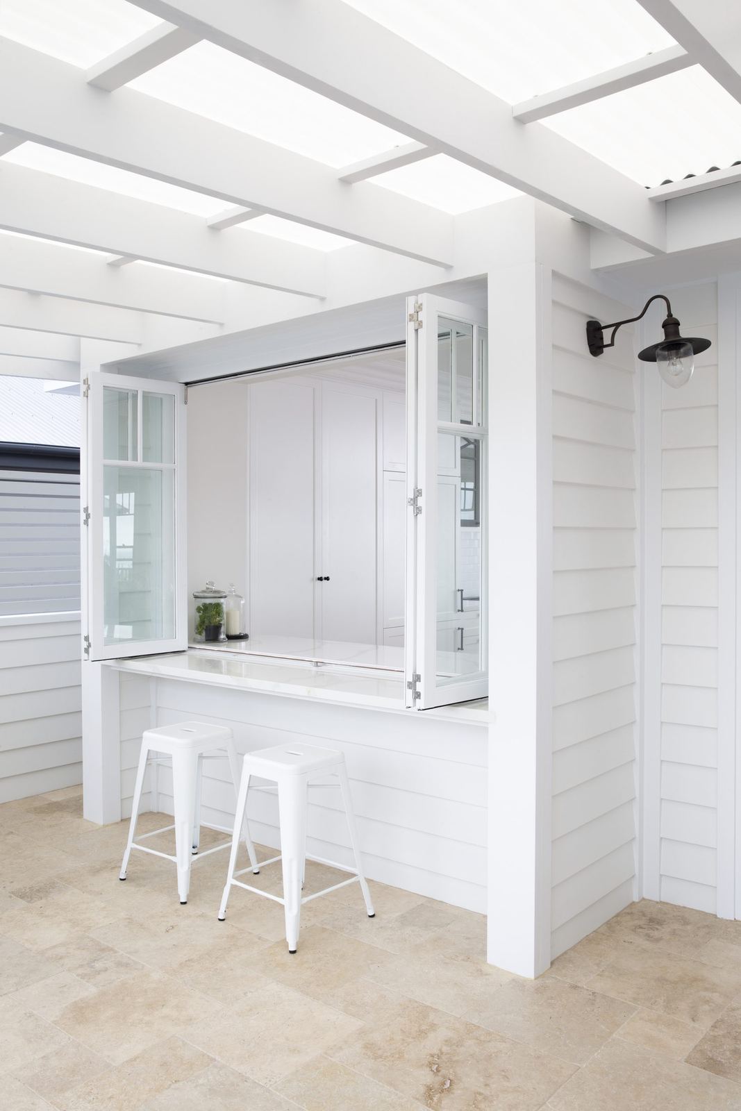 Balgowlah Heights — glass-roofed servery with white bar bench and bar stools, built by HP Constructions with All Australian Architecture