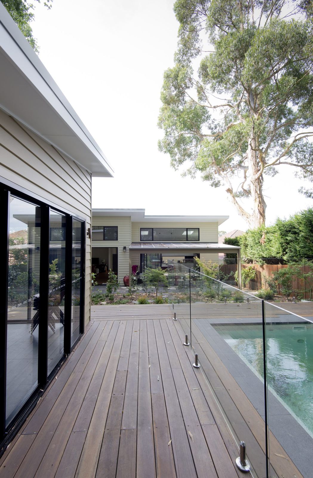 Balgowlah — timber pool deck with glass balustrade and glazed contemporary extension, built by HP Constructions with Scope Architects