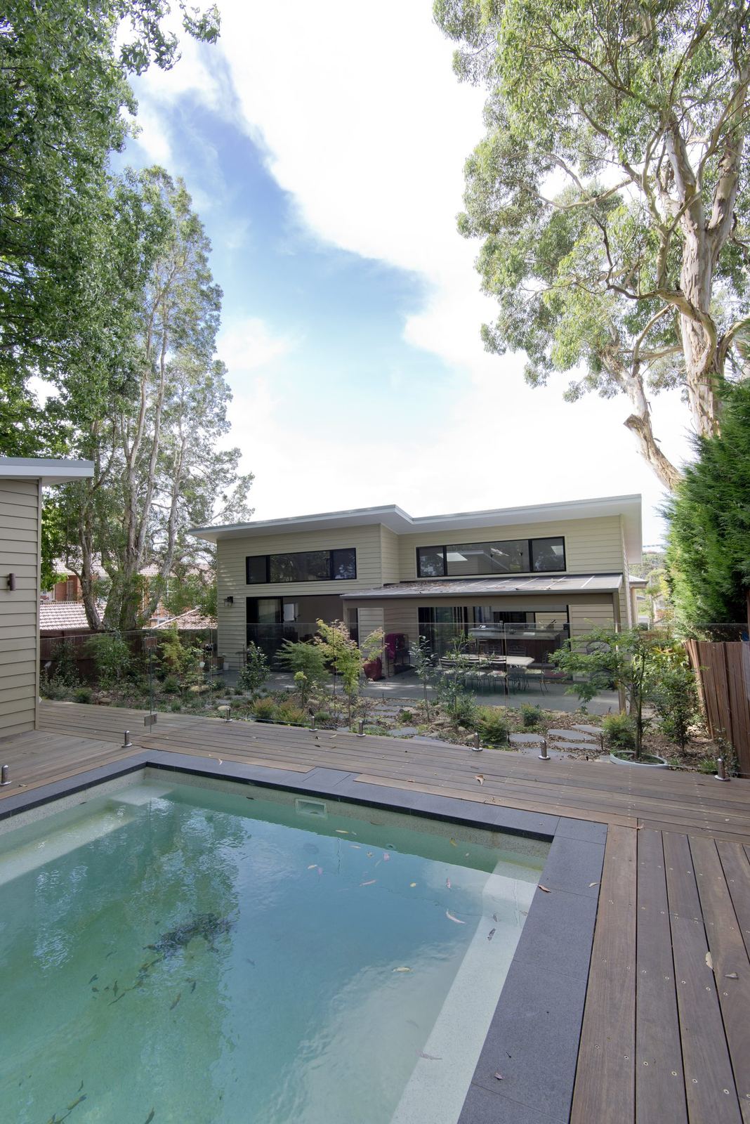 Balgowlah — concrete pool beside a timber deck and the contemporary rear extension, built by HP Constructions with Scope Architects