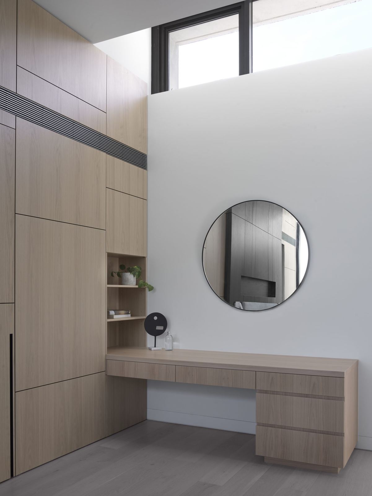 Castle Cove — dressing area with timber vanity, round mirror and skylight, built by HP Constructions with Dieppe Design