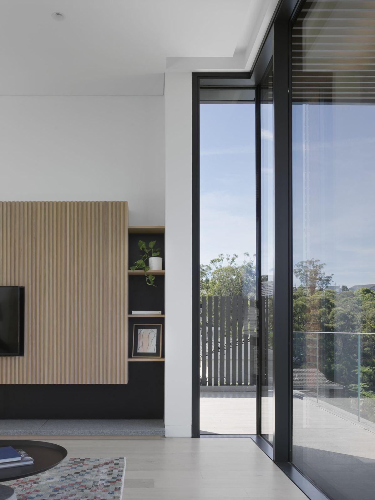 Castle Cove — kitchen with timber joinery and sliding door to balcony view, built by HP Constructions with Dieppe Design