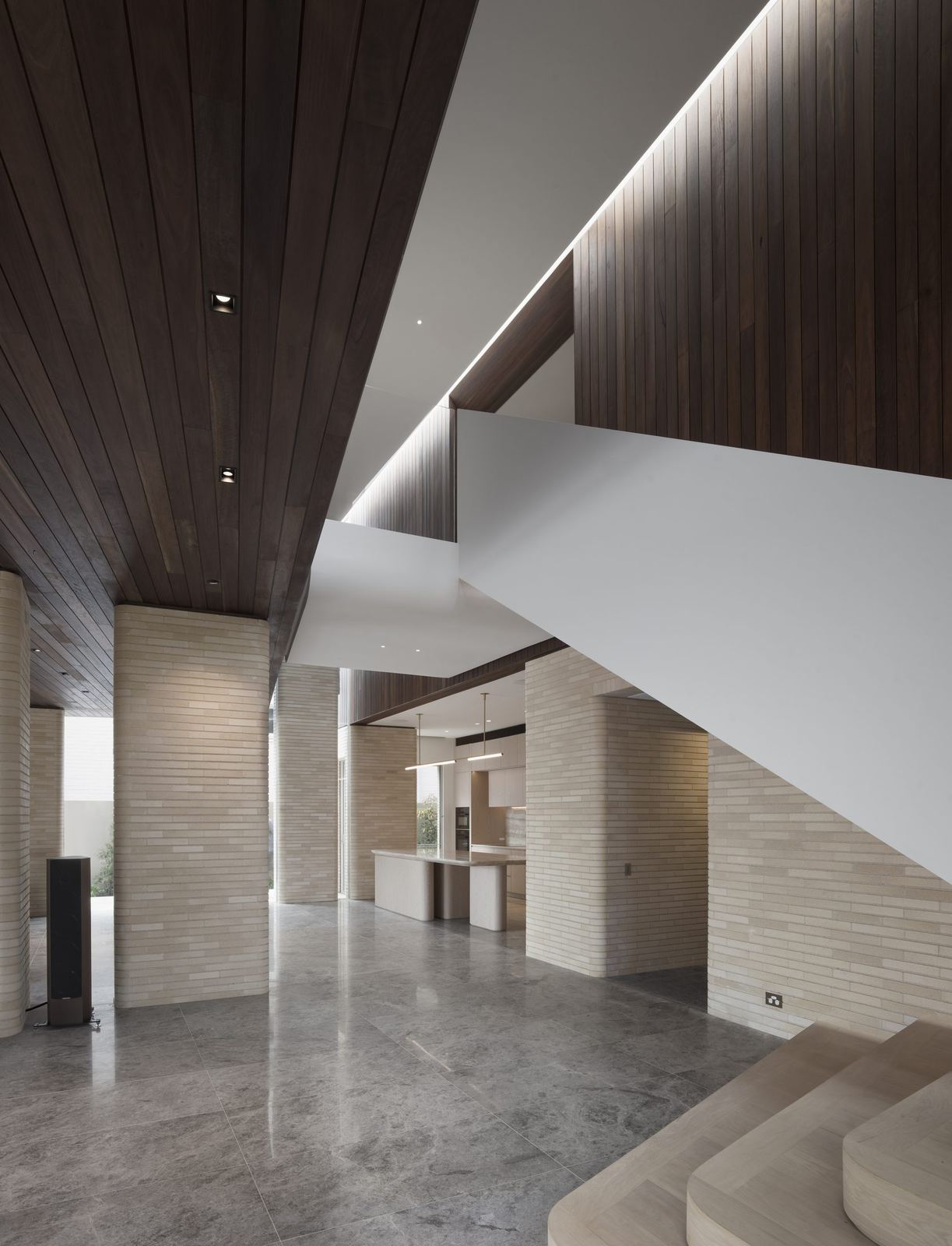 Castlecrag — interior with timber-lined ceiling, travertine walls and stone floor, built by HP Constructions with FJC Studio