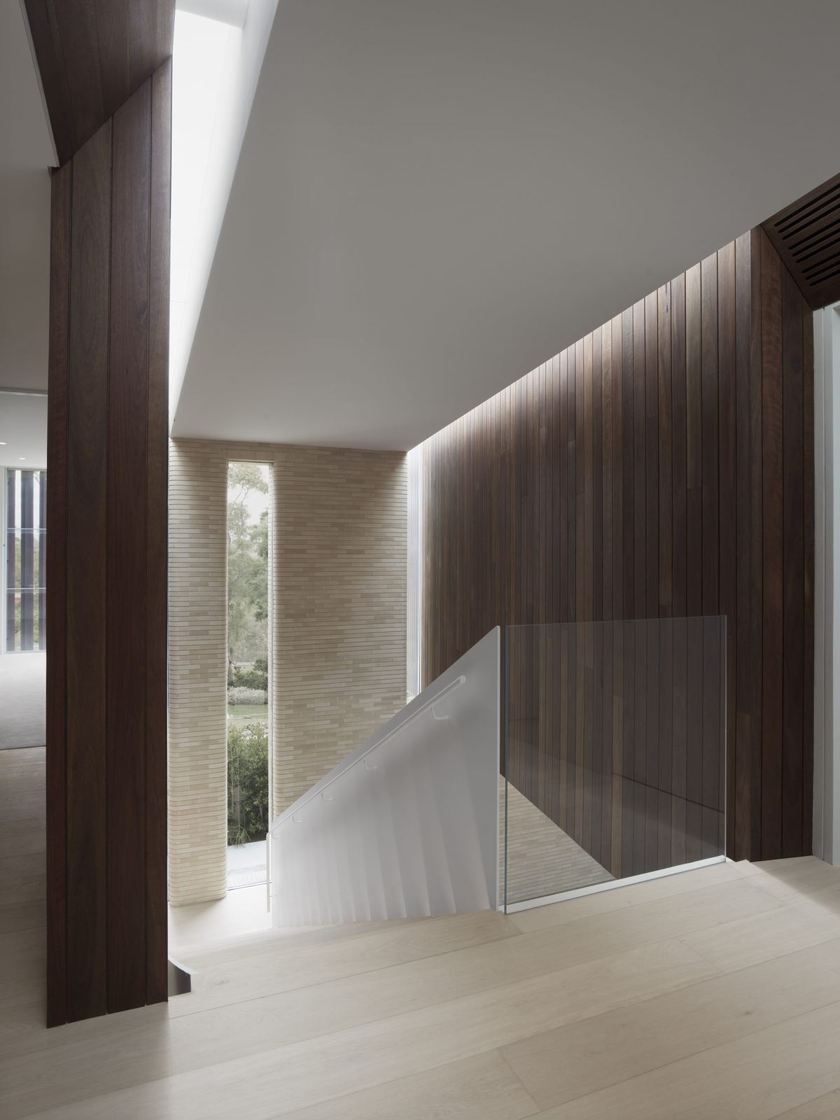 Castlecrag — stair void with timber walls and sculptural white ceiling, built by HP Constructions with FJC Studio