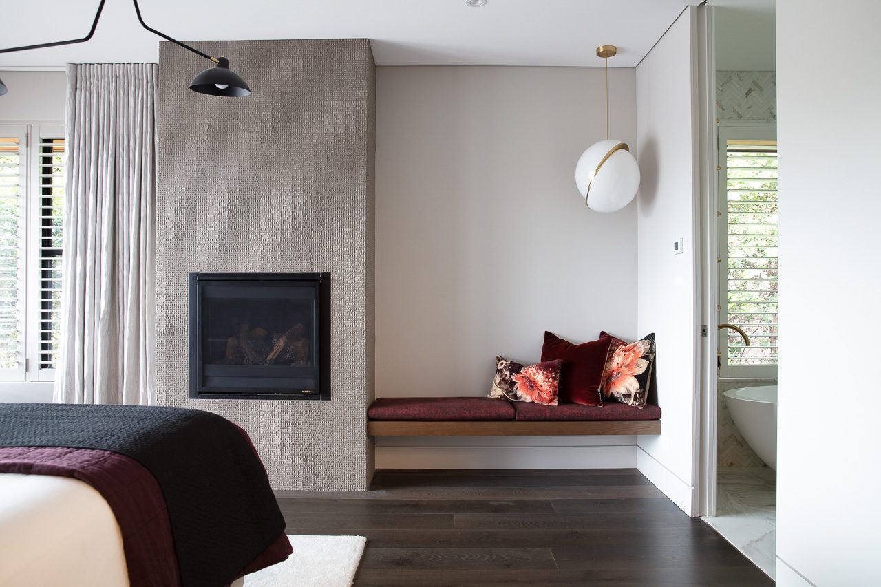 Hunters Hill — bedroom with fireplace, built-in window seat and ensuite beyond, built by HP Constructions with Dale Design Group