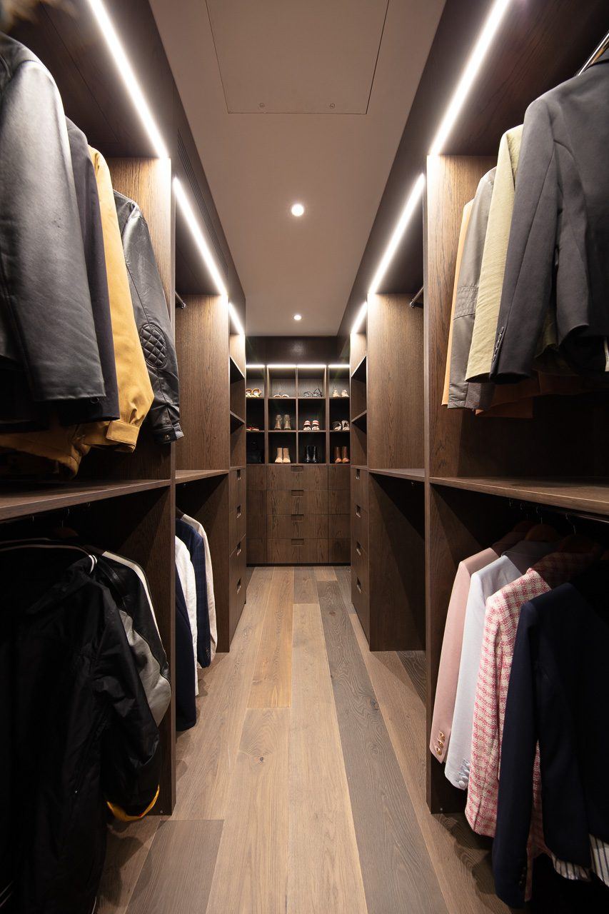 Hunters Hill — walk-in dressing room with LED-lit joinery and hanging clothes, built by HP Constructions with Dale Design Group