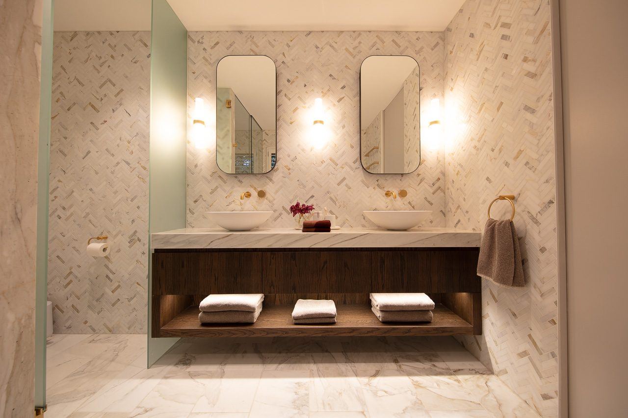 Hunters Hill — double vanity bathroom with twin mirrors and herringbone tiled wall, built by HP Constructions with Dale Design Group