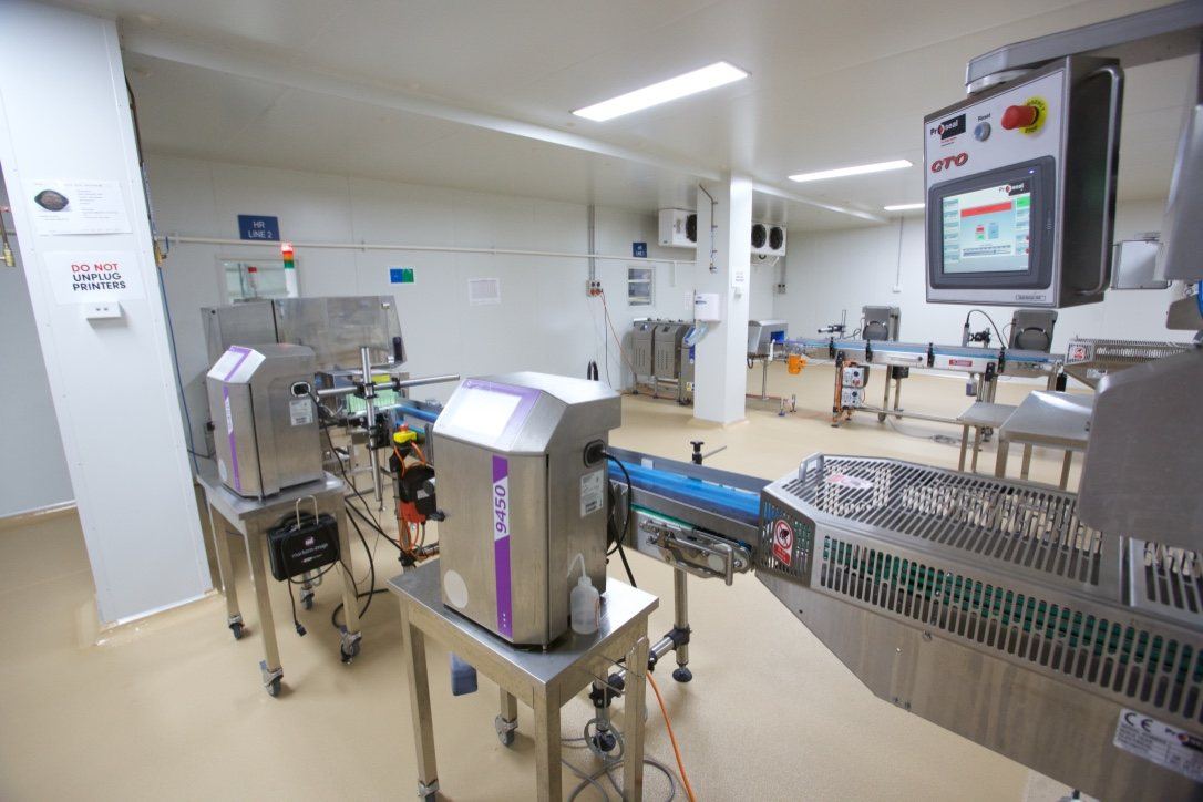 Kitchen Food Company — packaging line with control panel and conveyor equipment, built by HP Constructions