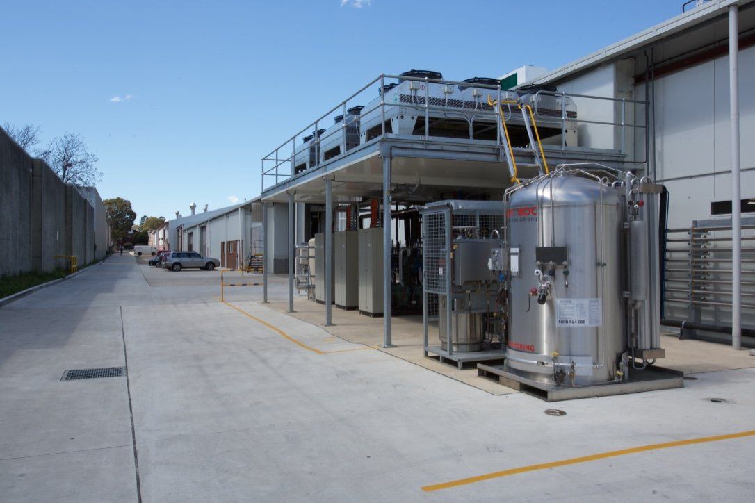 Kitchen Food Company — exterior driveway beside plant equipment and a storage tank, built by HP Constructions
