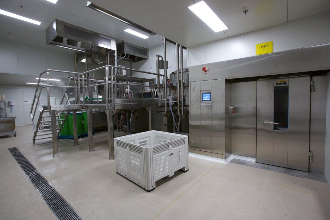Kitchen Food Company — stainless production room with processing equipment and access stairs, built by HP Constructions