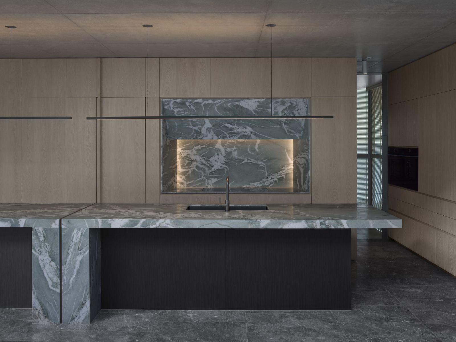 Lurline Bay — kitchen and dining with green marble splashback and island, built by HP Constructions with FJC Studio