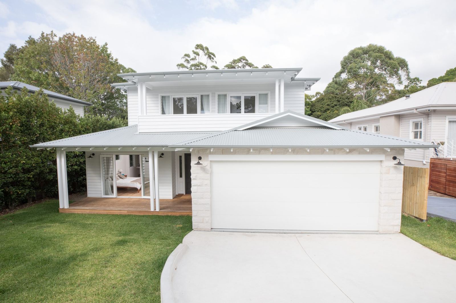 North Balgowlah — front facade of white weatherboard Hamptons home with double garage, built by HP Constructions with J.D Evans & Co