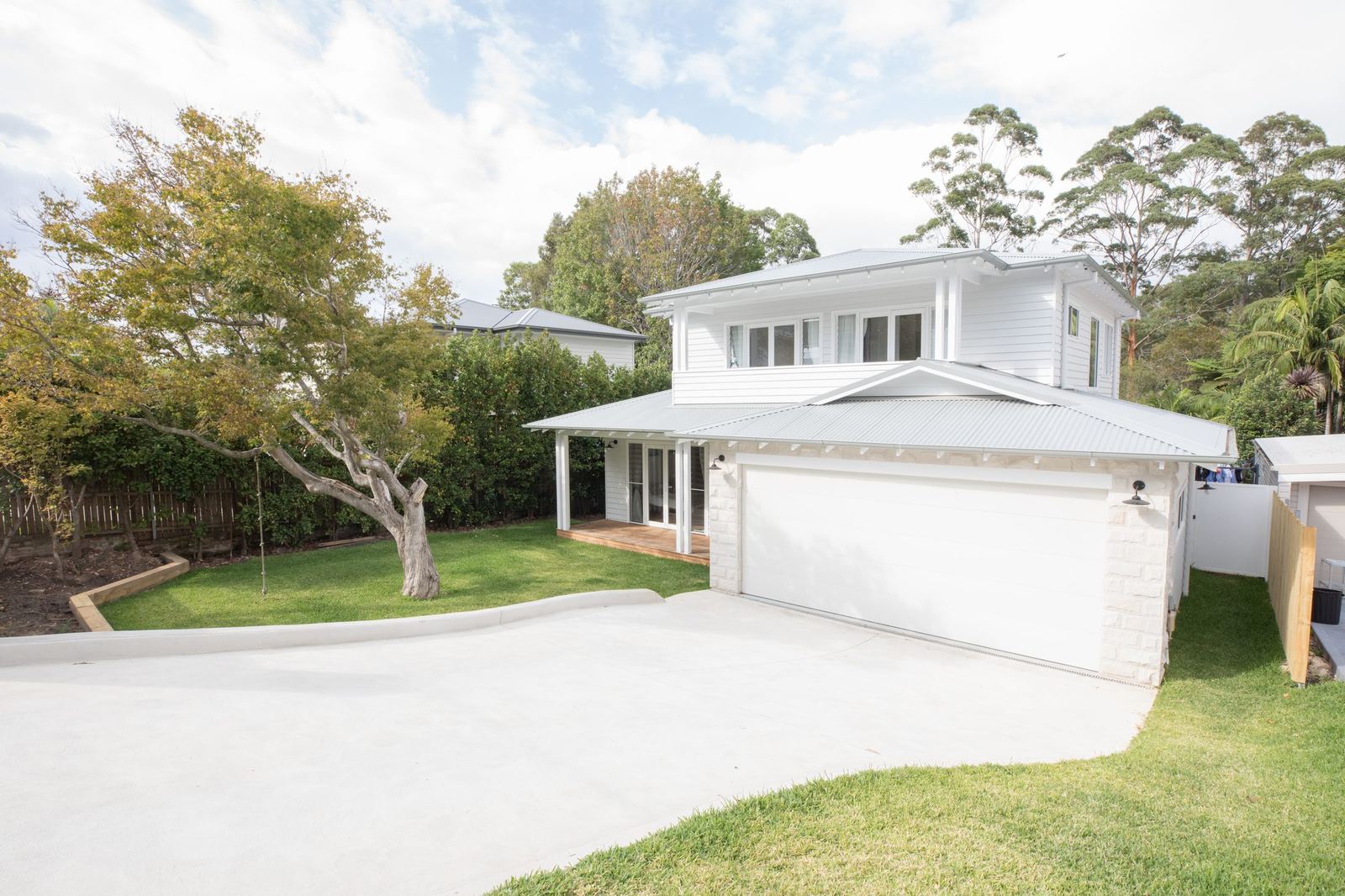 North Balgowlah — front exterior with double garage, driveway and large tree, built by HP Constructions with J.D Evans & Co