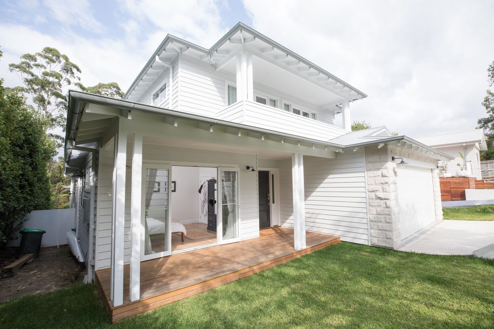 North Balgowlah — rear elevation of white weatherboard home with upper balcony, built by HP Constructions with J.D Evans & Co