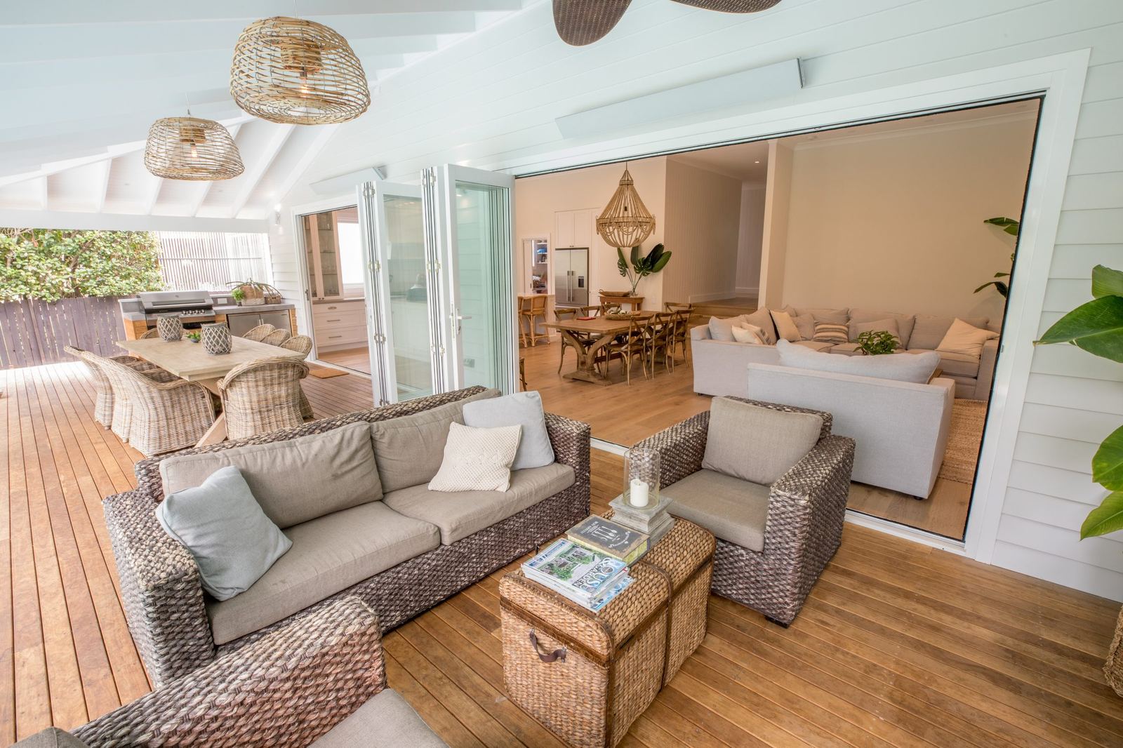North Balgowlah — covered deck lounge with wicker sofas under vaulted ceiling, built by HP Constructions with J.D Evans & Co