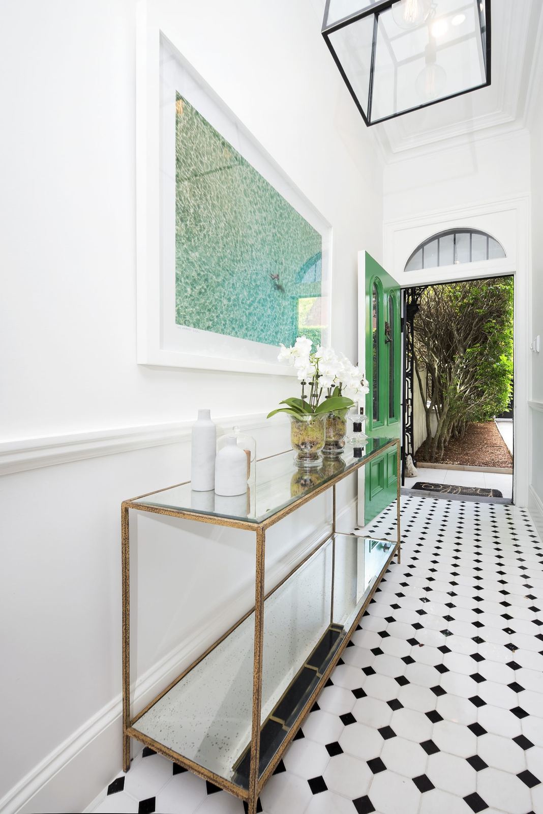 Paddington — entry hallway with black-and-white tiled floor and arched garden doorway, built by HP Constructions with Gutnik Design Group