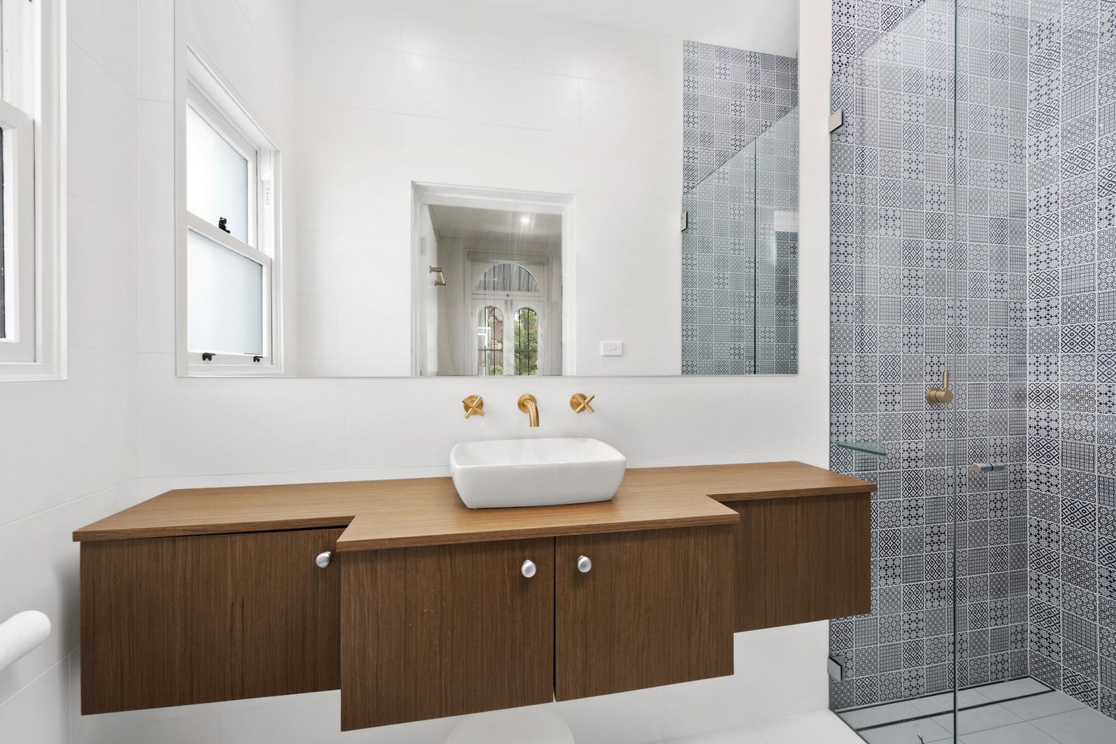 Paddington — bathroom with floating timber vanity, vessel basin and glass shower, built by HP Constructions with Gutnik Design Group