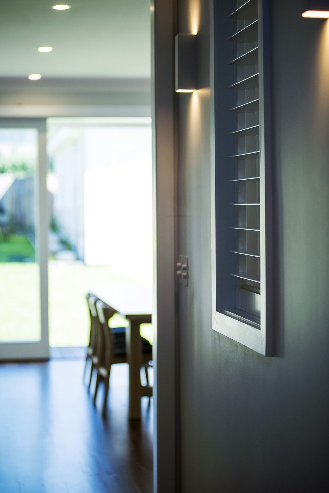 Seaforth — entry with a dark timber front door and view to living area, built by HP Constructions with Playoust Churcher