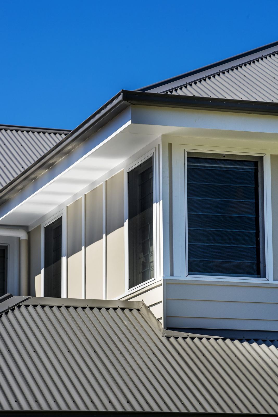 Seaforth — exterior roof detail with metal roofing and gabled weatherboard form, built by HP Constructions with Playoust Churcher