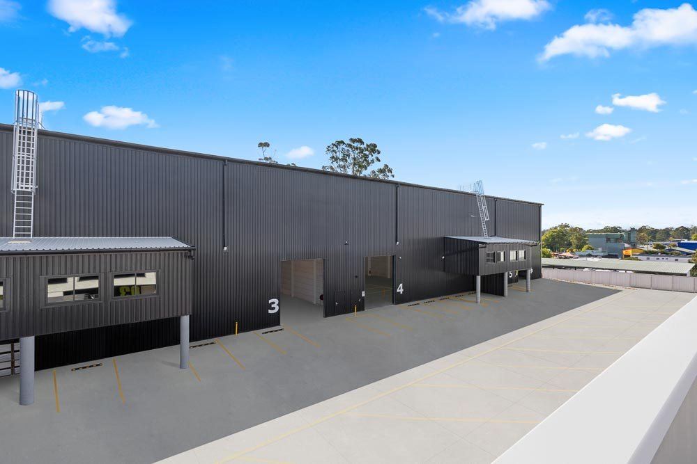 Thornleigh Warehouse — grey warehouse exterior with numbered loading docks under blue sky, built by HP Constructions