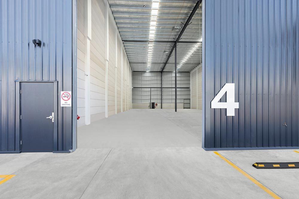 Thornleigh Warehouse — warehouse interior at roller-door entrance with large number four, built by HP Constructions