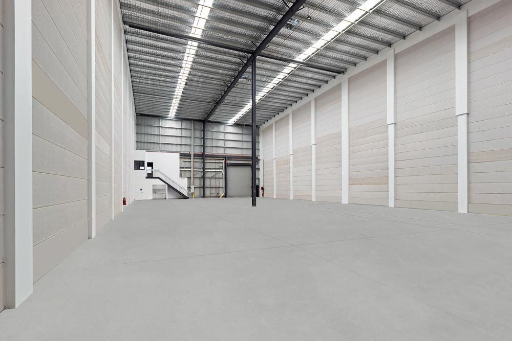 Thornleigh Warehouse — warehouse interior with cantilevered office suite and access stairs, built by HP Constructions