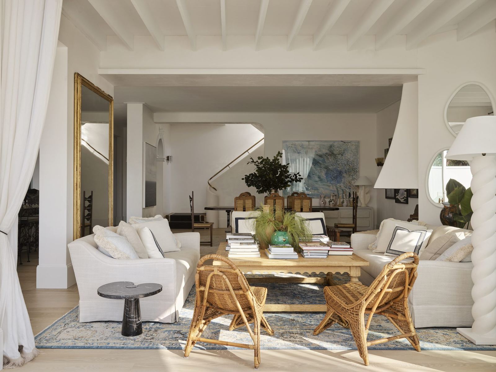 Vaucluse — sitting room with gilt mirror, rattan chairs and floor-length curtains, built by HP Constructions with Alexander & Co