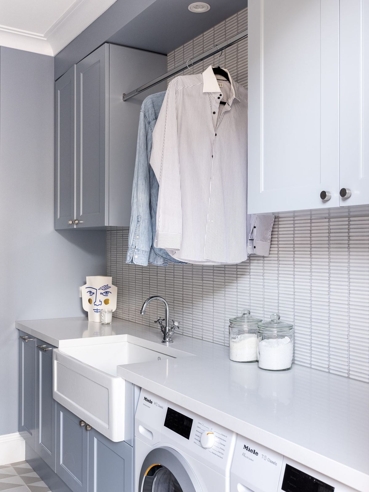 Willoughby — laundry with grey cabinetry, hanging rail and washing machine, built by HP Constructions with Alexander & Co