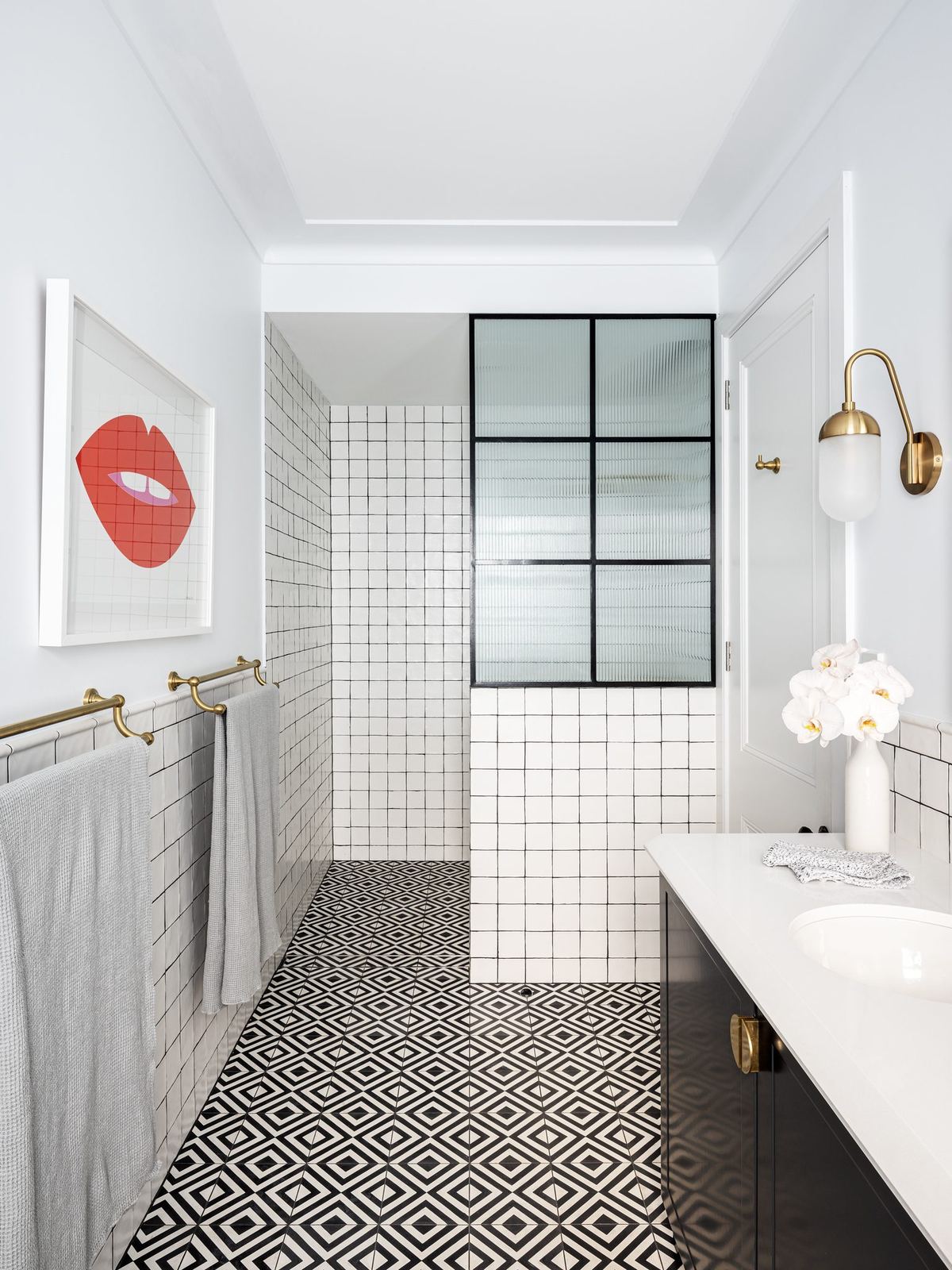 Willoughby — bathroom with patterned tiled floor and steel-framed shower screen, built by HP Constructions with Alexander & Co